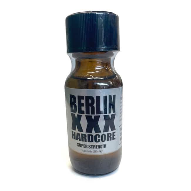 Sentence with Product Name: A bottle of Berlin XXX 25ml super strength product with a dark cap and a label emphasizing its intensity, containing 25 ml of liquid.